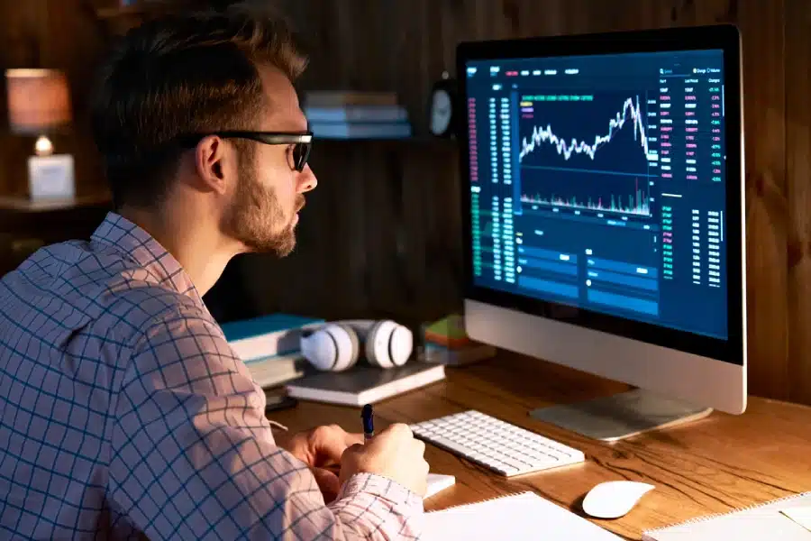 A cryptotrader looking at a computer.