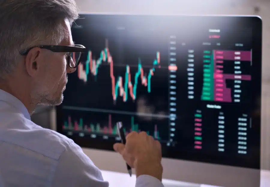 A cryptotrader looking at a computer screen.
