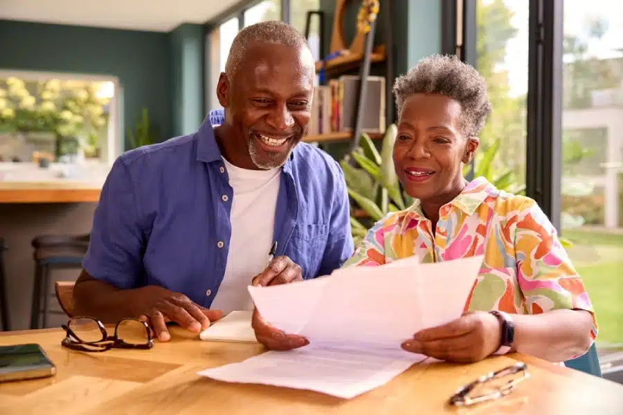 A retired couple looking at documents.